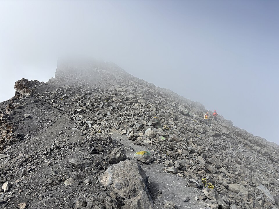 Hikers approaching the summit ridge of Mount Meru
